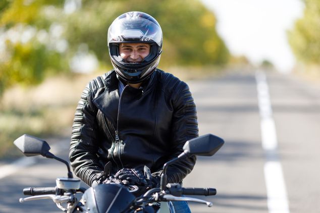 Close up of motorcyclist smiling 